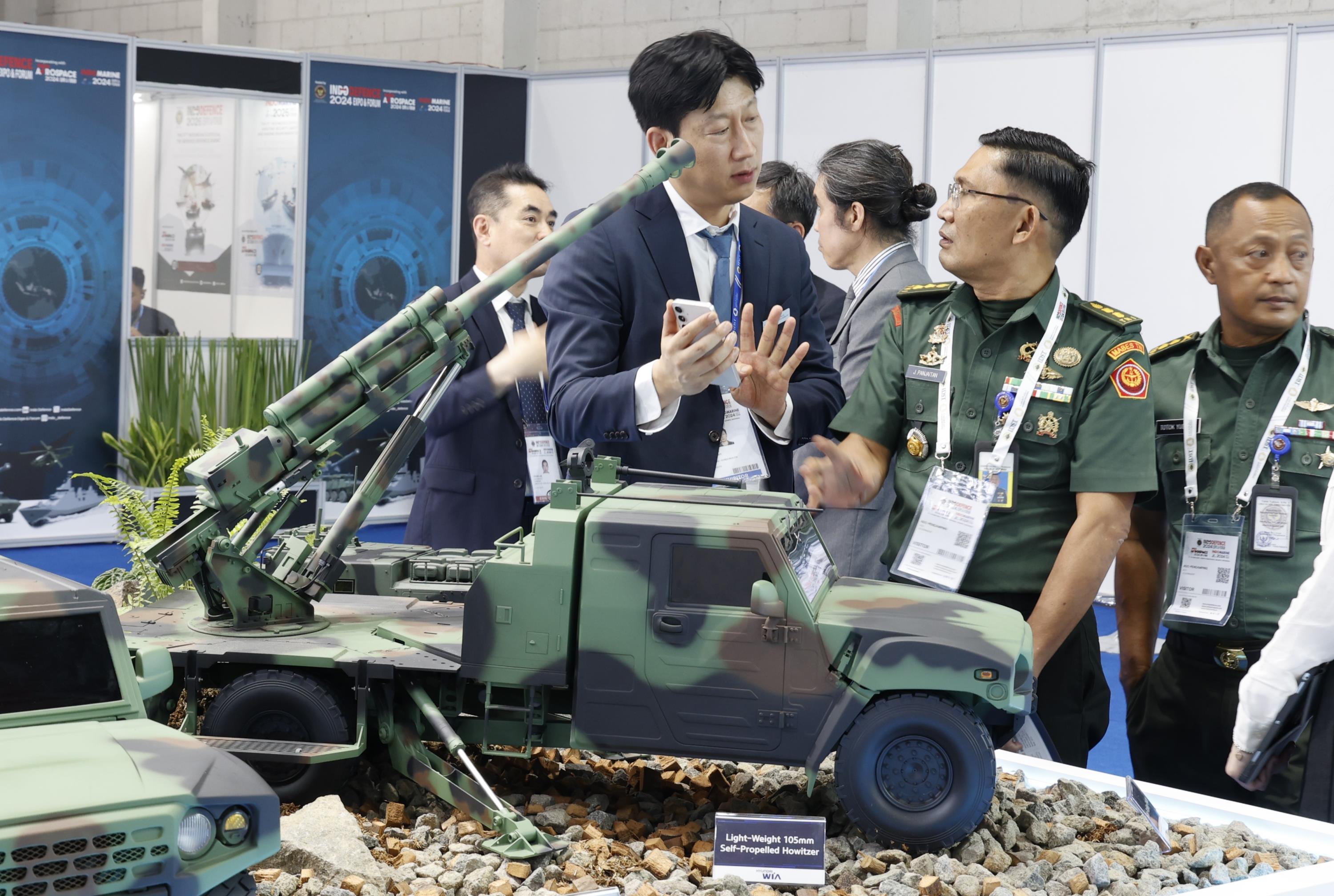 Visitors examining the defense products at the HYUNDAI WIA booth at the INDO Defence 2024 Expo & Forum in Jakarta, Indonesia. Courtesy of HYUNDAI WIA.